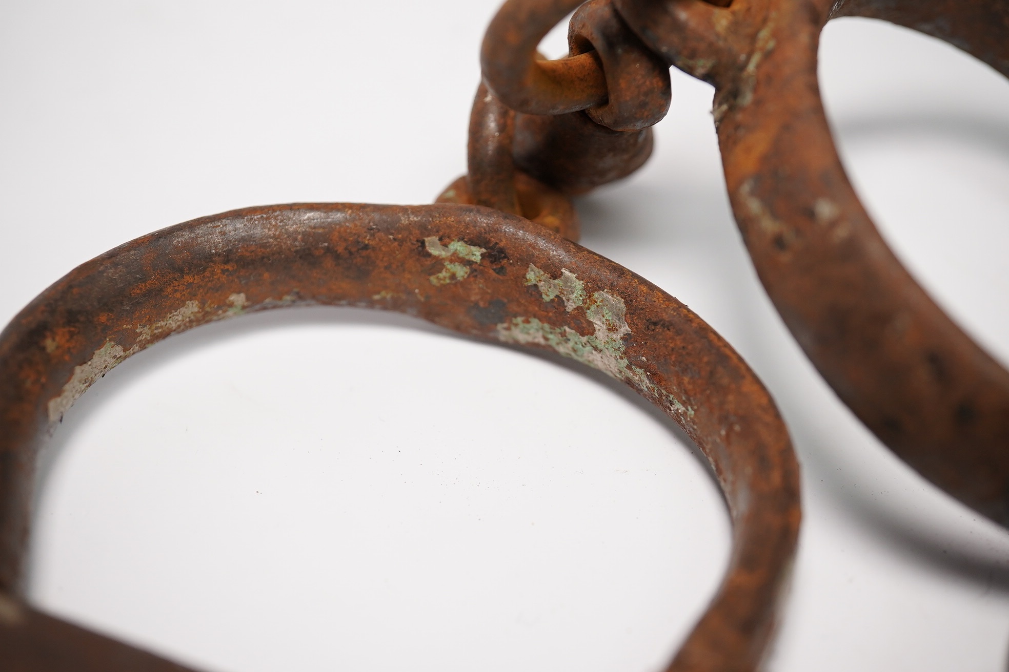 19th/20th century police hand cuffs and two whistles. Condition - poor